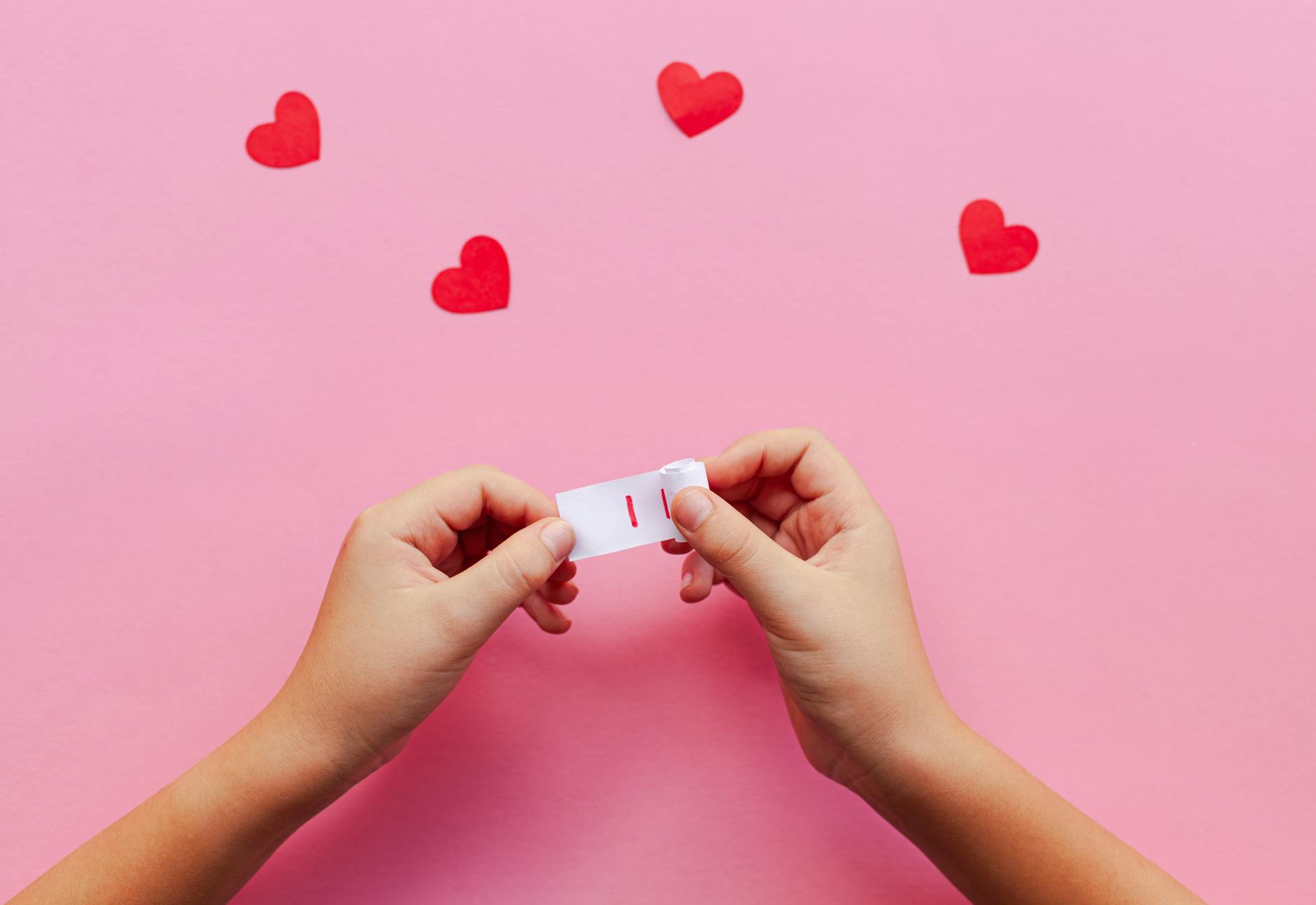 romantic message with hearts on pink backdrop